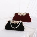 Corduroy clutch bag with decorative closure
