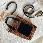 Two-tone suede purse with leather accents