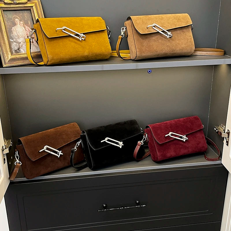 Structured suede handbag with minimalist shape
