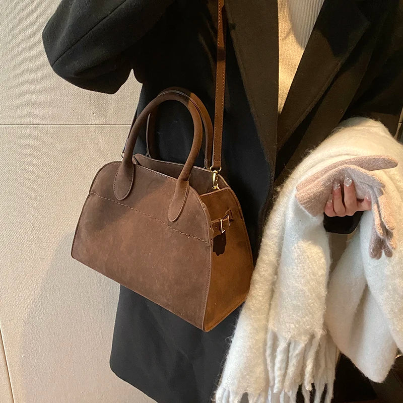 Suede handbag with shoulder strap