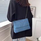 Flap-style denim shoulder handbag