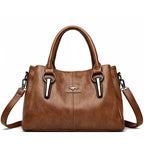 Leather handbag with detachable shoulder strap
