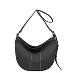 Soft washed denim shoulder bag with casual fold design