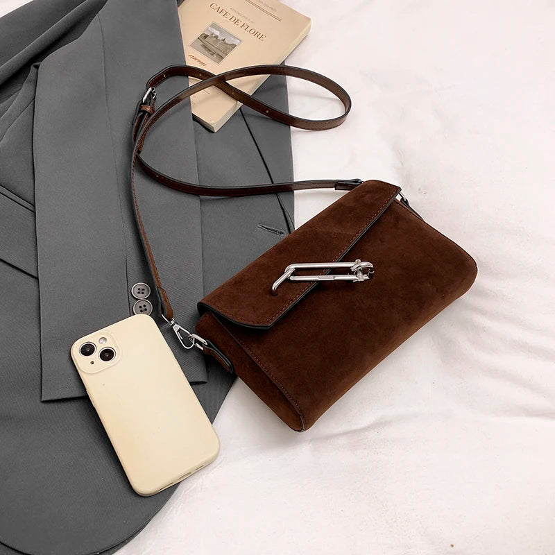Structured suede handbag with minimalist shape