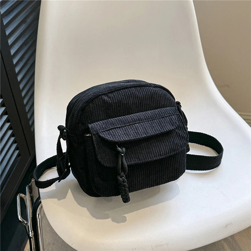 Small corduroy handbag with front zipper pocket