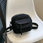 Small corduroy handbag with front zipper pocket