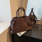 Suede handbag with shoulder strap