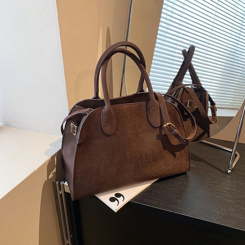Suede handbag with shoulder strap