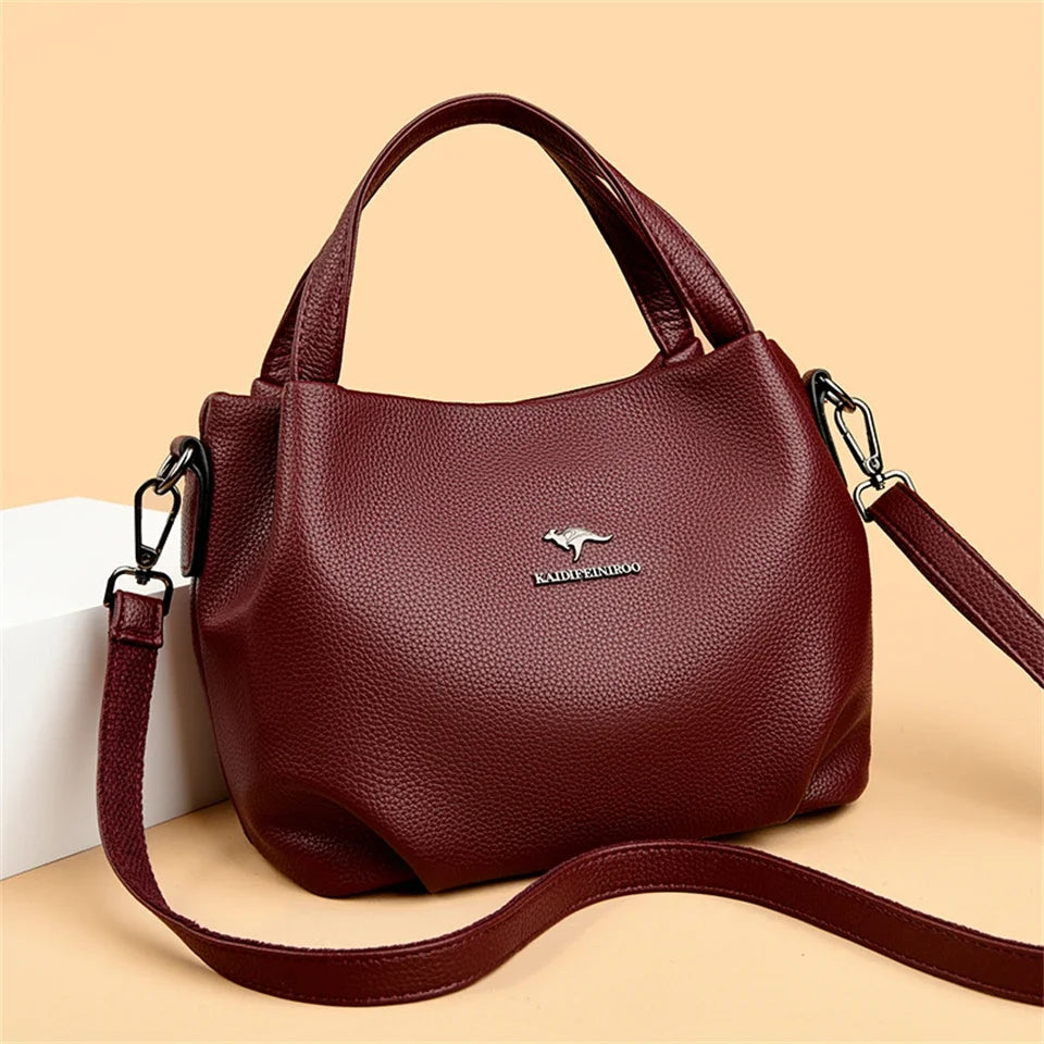 Leather handbag with wide base