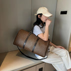 Textured leather travel duffle bag