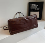 Zip-top leather overnight duffle bag
