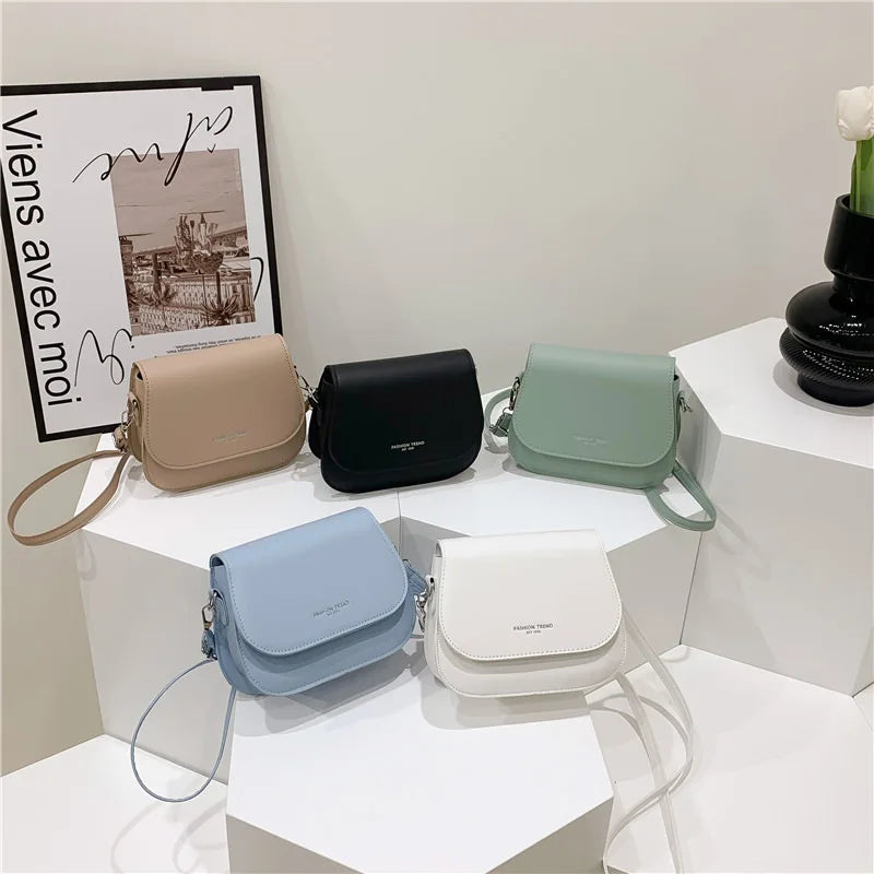 Compact leather sling crossbody