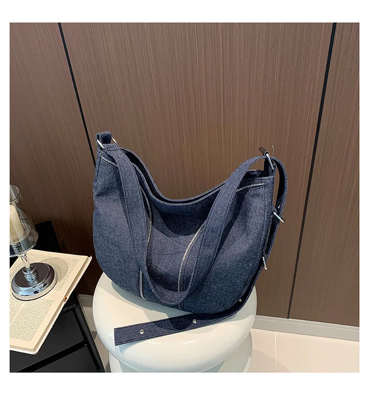 Soft washed denim shoulder bag with casual fold design