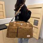 Corduroy travel toiletry bag with shoulder strap