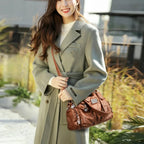 Leather shoulder bag with side pockets