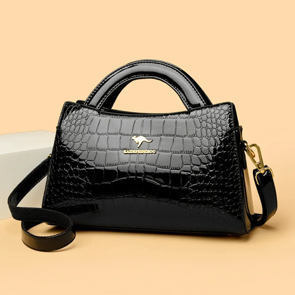 Soft leather handbag with curved top edge