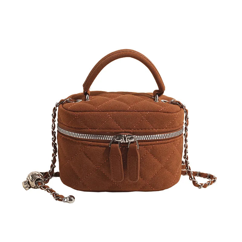 Classic suede handbag with structured handle