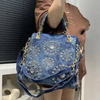 Elegant floral embroidered denim handbag with chain handle