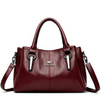Leather handbag with detachable shoulder strap