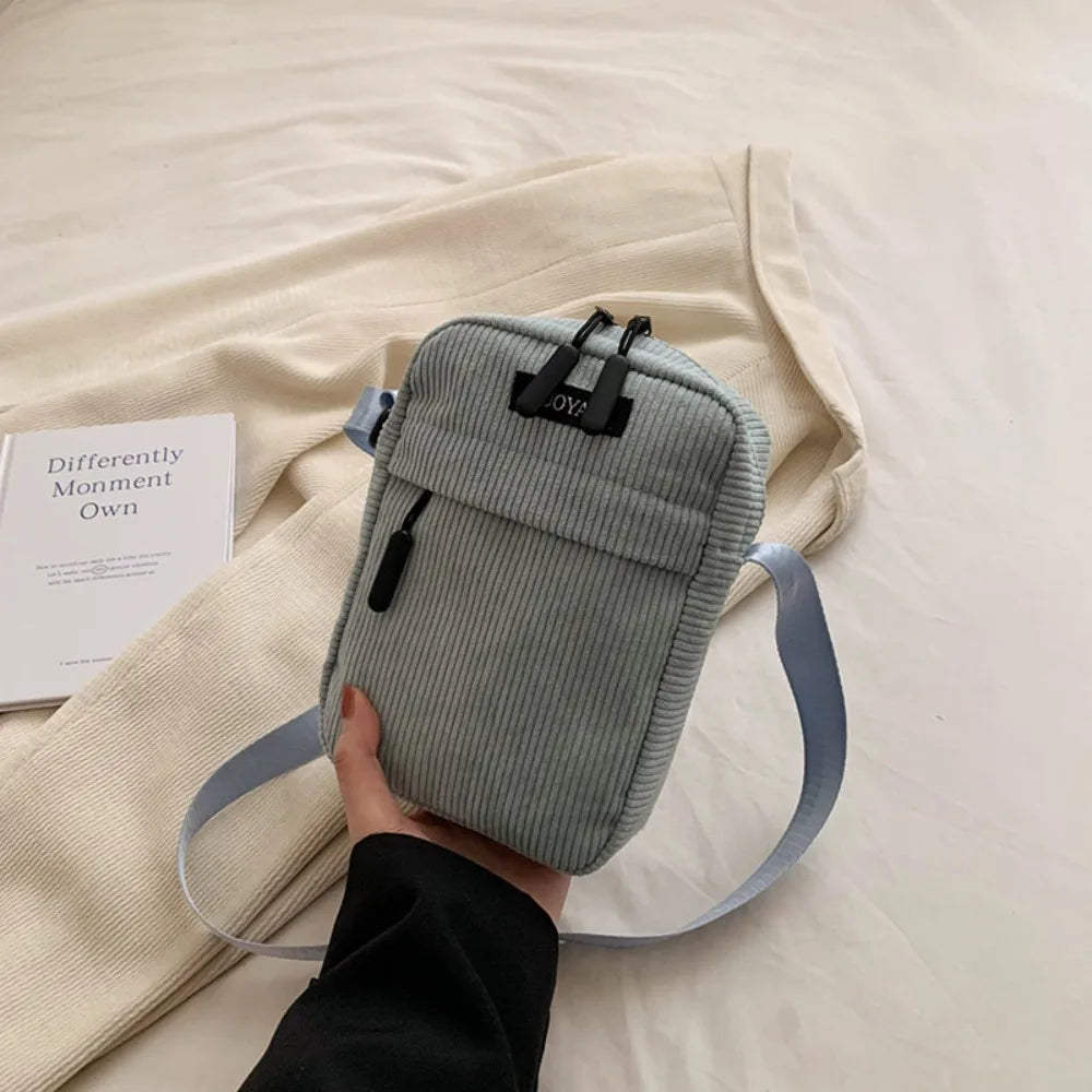 Compact corduroy crossbody bag