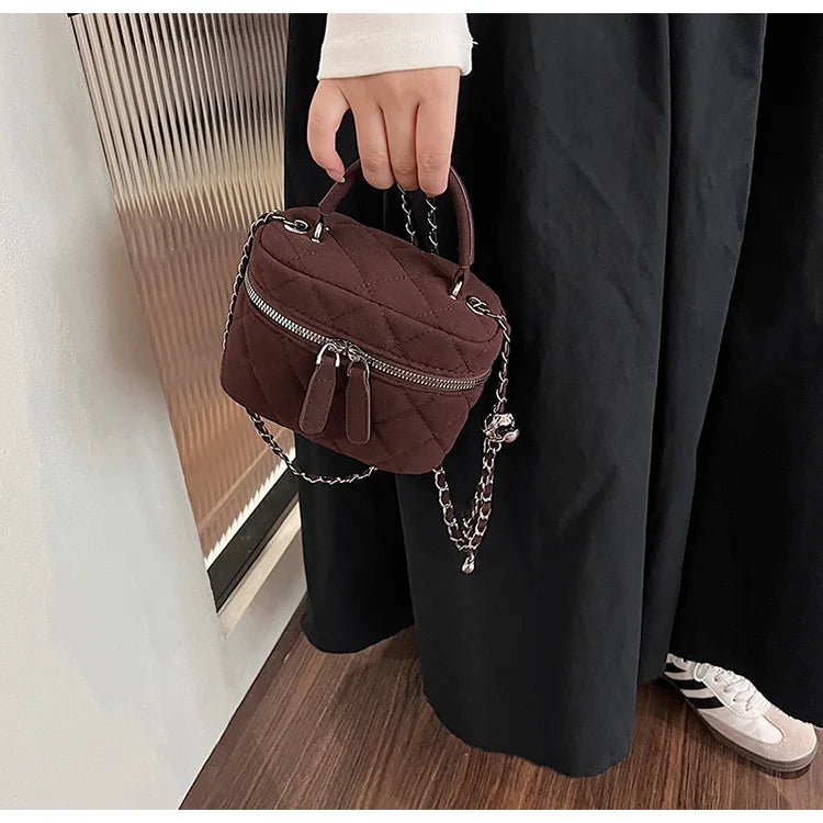Classic suede handbag with structured handle