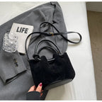 Everyday suede handbag with strap