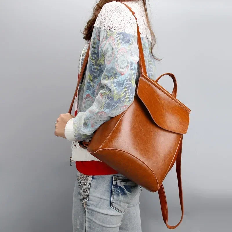 Women’ leather bookbag-style backpack