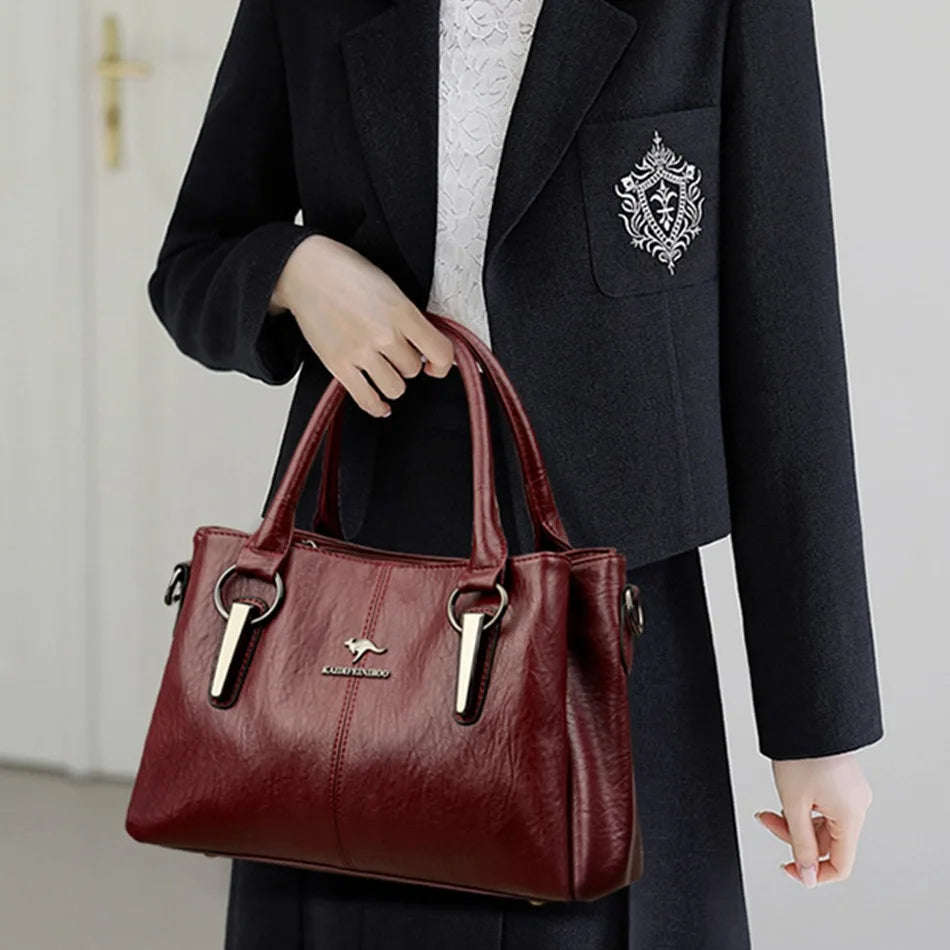 Leather handbag with detachable shoulder strap