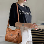 Leather shoulder bag with adjustable strap