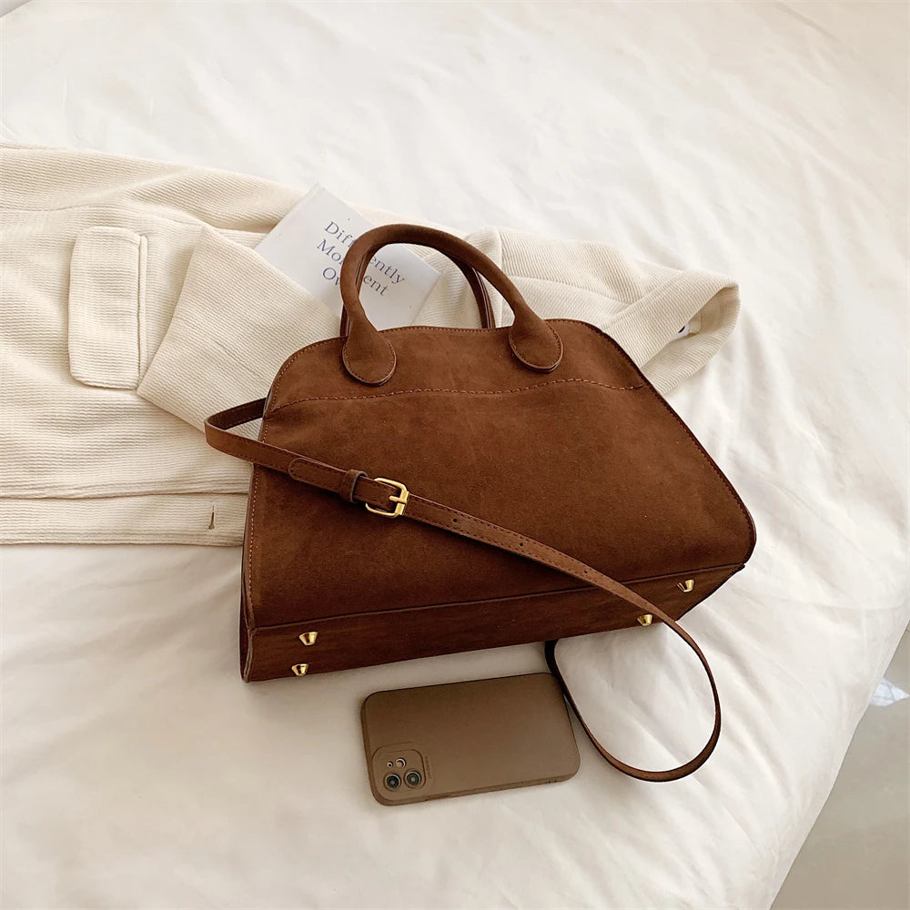 Suede handbag with shoulder strap