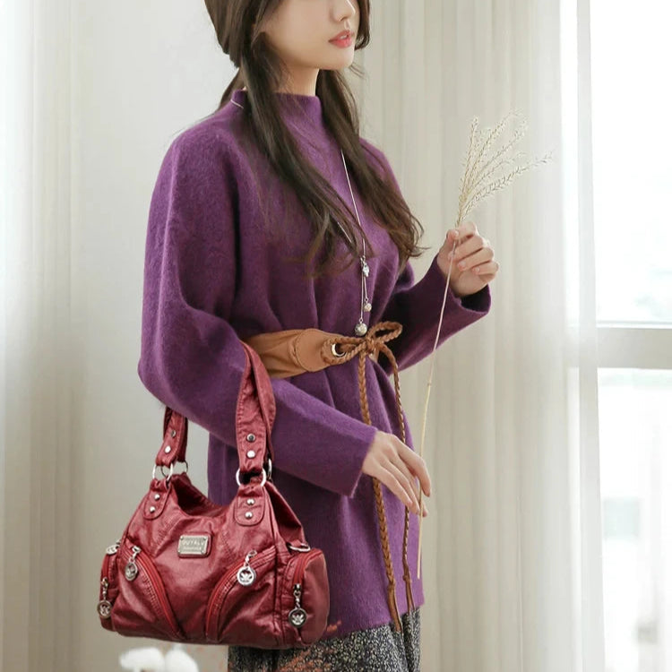 Leather shoulder bag with side pockets
