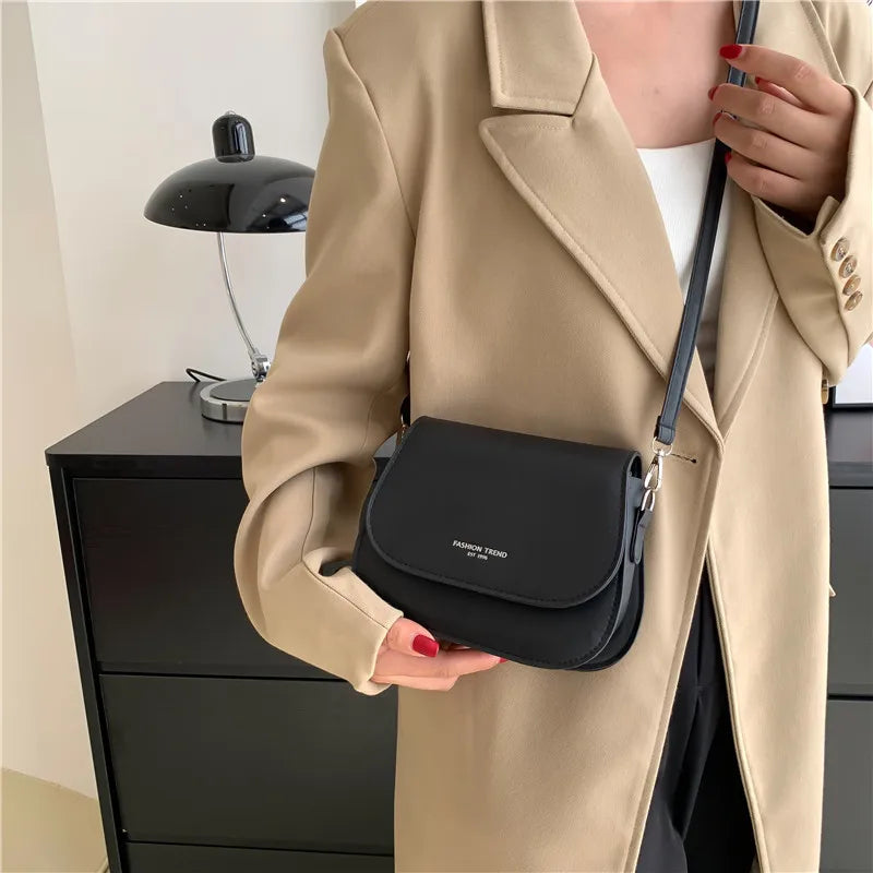 Compact leather sling crossbody