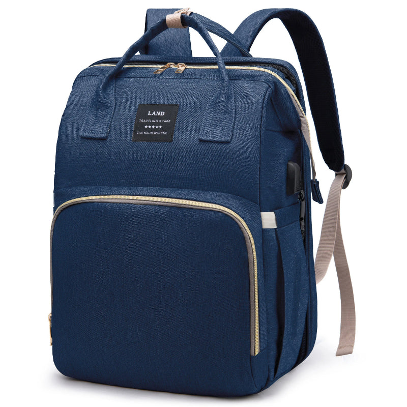 Blue diaper backpack with built-in bed