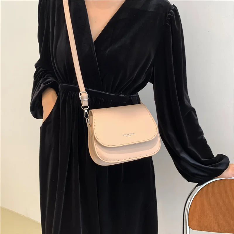 Compact leather sling crossbody
