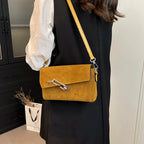 Structured suede handbag with minimalist shape
