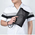 Minimalist leather clutch with detachable strap