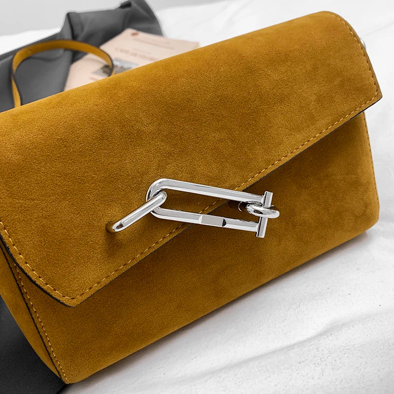 Structured suede handbag with minimalist shape