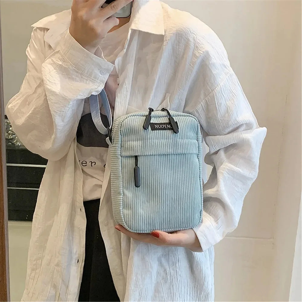 Compact corduroy crossbody bag