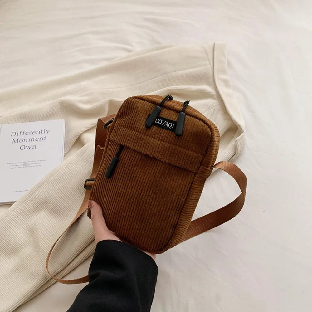 Compact corduroy crossbody bag