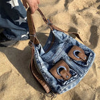 Trendy denim backpack with leather strap detail