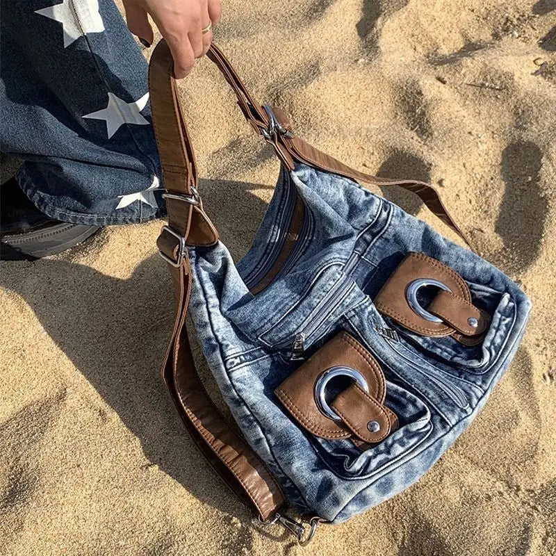 Trendy denim backpack with leather strap detail