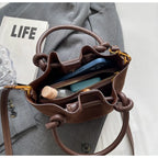 Everyday suede handbag with strap