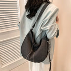 Soft washed denim shoulder bag with casual fold design