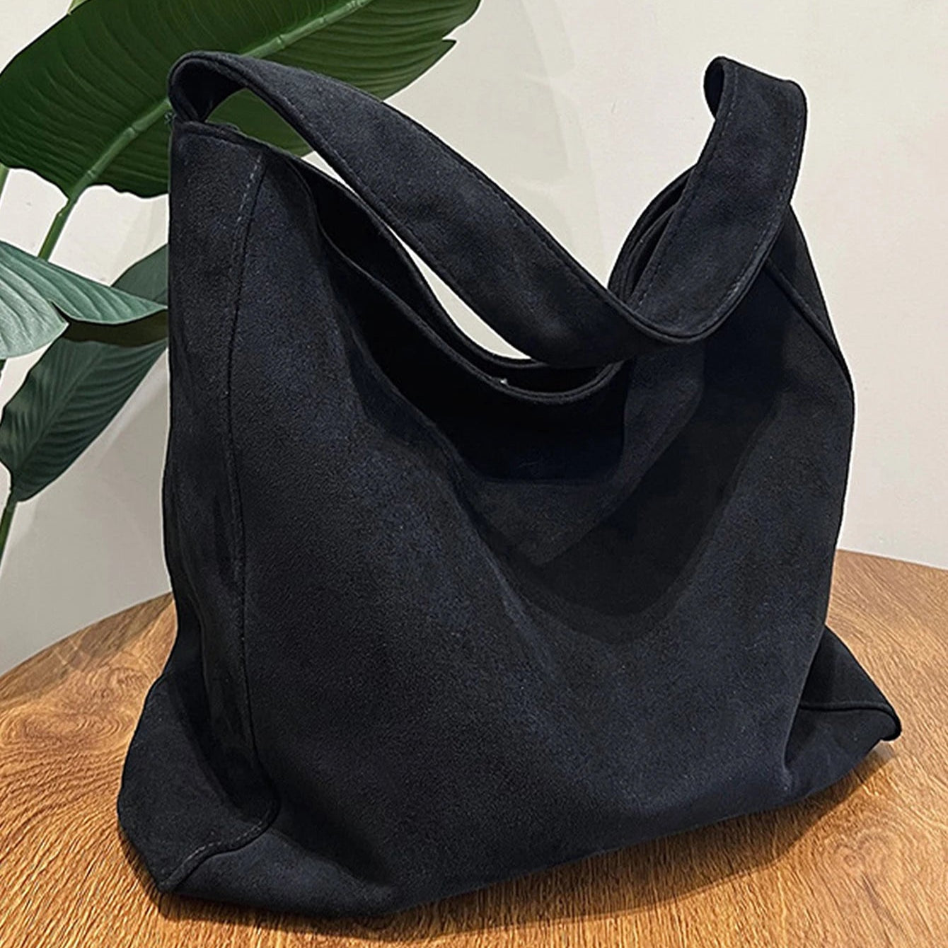 Suede slouch bag with relaxed boho silhouette