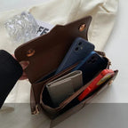Compact leather sling bag for daily essentials