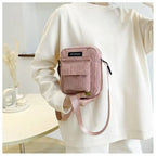 Corduroy crossbody handbag with front pocket