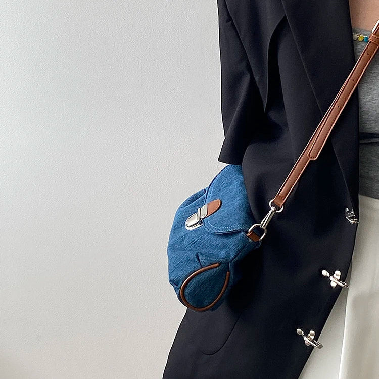 Denim handbag with leather handles
