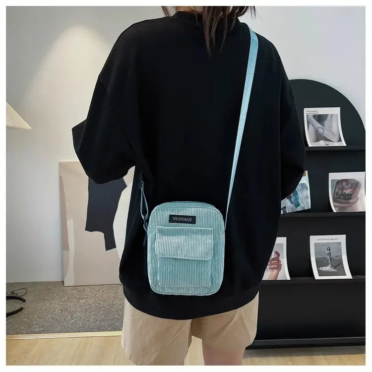 Corduroy crossbody handbag with front pocket