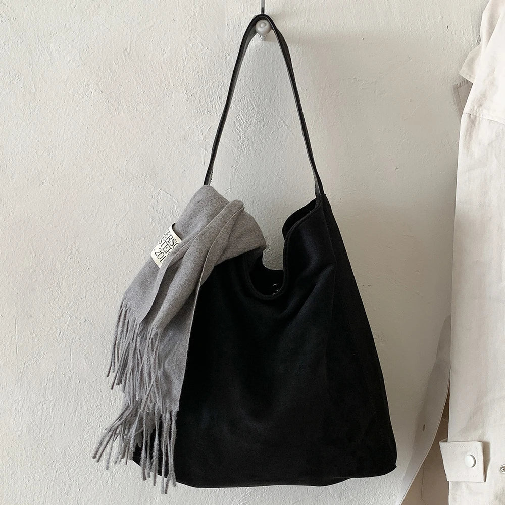 Suede slouch bag with relaxed boho silhouette