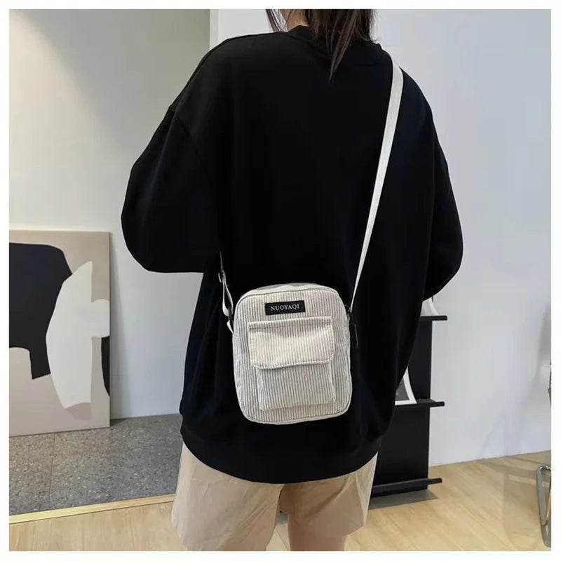 Corduroy crossbody handbag with front pocket